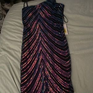 The brand is dillards, the colors are pink, purple, blue and black! one shoulder